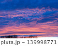Beautiful blue hour sky with pink and purple sunset clouds over trees 139998771
