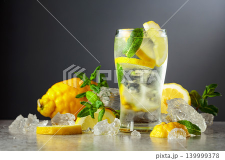 Carbonated refreshing drink with fresh lemon, ice and mint. Carbonated refreshing drink with fresh lemon, ice and mint. 139999378
