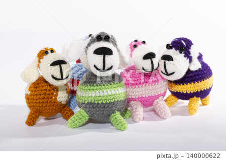 Knitted woolen dogs on a white background Knitted woolen dogs on a white background 140000622