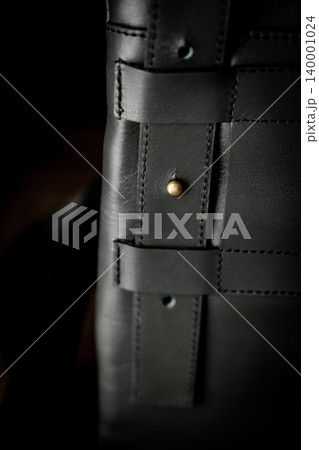 Fashionable mens bag, men purse, wallet men's casual outfits with leather accessories, brown bag on wooden board background Fashionable mens bag, men purse, wallet men's casual outfits with leather accessories, brown bag on wooden board background 140001024