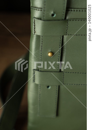 Fashionable mens bag, men purse, wallet men's casual outfits with leather accessories, brown bag on wooden board background 140001025