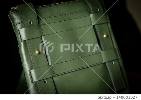 Fashionable mens bag, men purse, wallet men's casual outfits with leather accessories, brown bag on wooden board background Fashionable mens bag, men purse, wallet men's casual outfits with leather accessories, brown bag on wooden board background 140001027