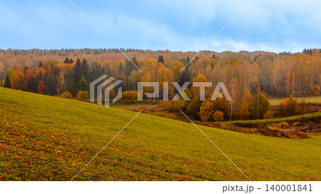 Vibrant autumn landscape with colorful foliage and rolling hills in a serene countryside setting Vibrant autumn landscape with colorful foliage and rolling hills in a serene countryside setting 140001841