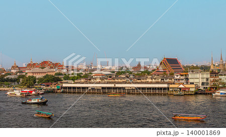 Cityscape view of riverside temples and boats during daytime in Bangkok, Thailand 140001869