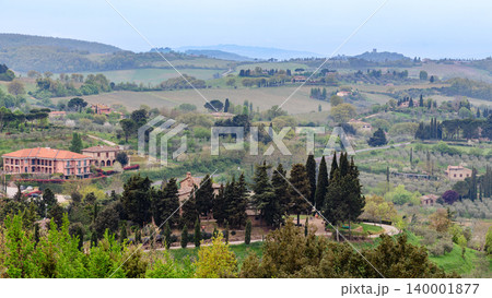 Rolling hills and picturesque vineyards create a tranquil countryside landscape Rolling hills and picturesque vineyards create a tranquil countryside landscape 140001877