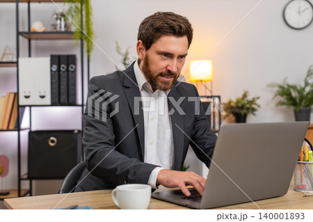 Middle-aged businessman rewrites polite complaint on laptop deletes phrase breathes calm typing soft Middle-aged businessman rewrites polite complaint on laptop deletes phrase breathes calm typing soft 140001893