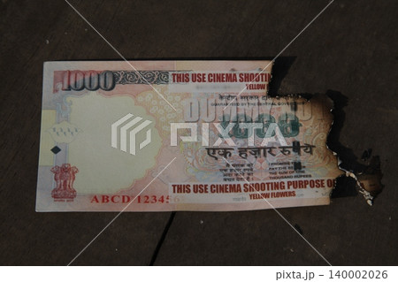 Burning Indian Currency closeup Burning Indian Currency closeup 140002026
