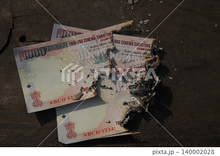 Burning Indian Currency closeup Burning Indian Currency closeup 140002028