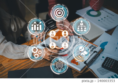 Dynamic team collaboration using digital tools for effective communication and productivity in a modern office setting. 140003353