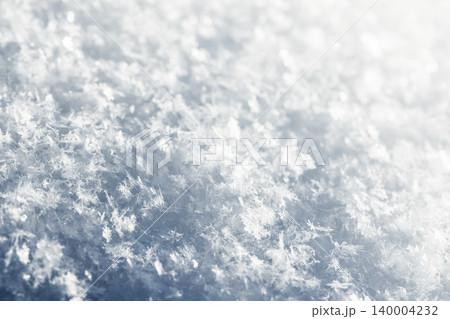Close-up macro of delicate snowflakes and frost crystals 140004232