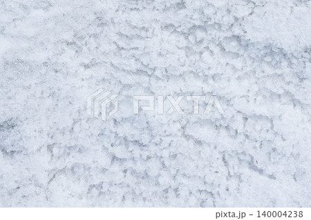 Close-up view of granular snow and icy crystals 140004238