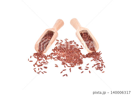 red rice in wooden scoop isolated on white background red rice in wooden scoop isolated on white background 140006317