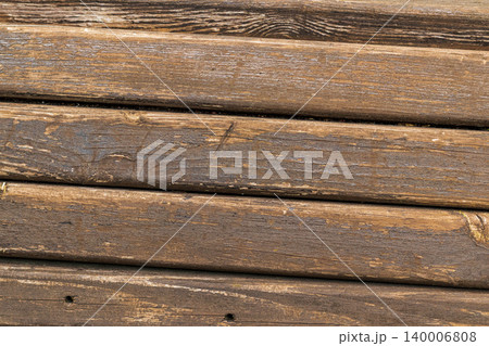 This is a texture of aged, rustic wooden planks with a dark brown, weathered grain This is a texture of aged, rustic wooden planks with a dark brown, weathered grain 140006808
