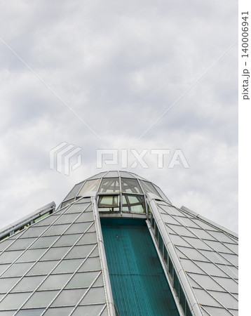 Modern Architectural Roof Detail with Slanted Panels and Teal Steel Truss 140006941