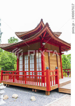 Traditional Japanese Teahouse Pavilion with Red Pillars and Shoji Doors Traditional Japanese Teahouse Pavilion with Red Pillars and Shoji Doors 140007817