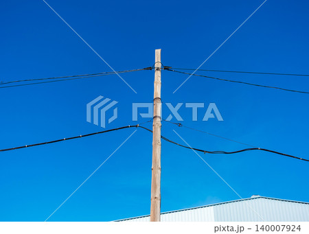 Concrete Utility Poles with Electrical Wires and Urban Background Concrete Utility Poles with Electrical Wires and Urban Background 140007924