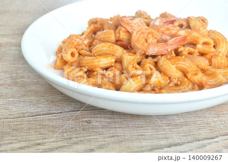 fried macaroni and shrimp with onion in ketchup sauce on plate fried macaroni and shrimp with onion in ketchup sauce on plate 140009267