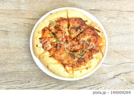 Korean pizza topping slice pork dressing spicy sesame sauce on plate Korean pizza topping slice pork dressing spicy sesame sauce on plate 140009269