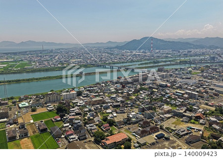 宮崎県延岡市の市街地と五ヶ瀬川を俯瞰した空撮写真 宮崎県延岡市の市街地と五ヶ瀬川を俯瞰した空撮写真 140009423