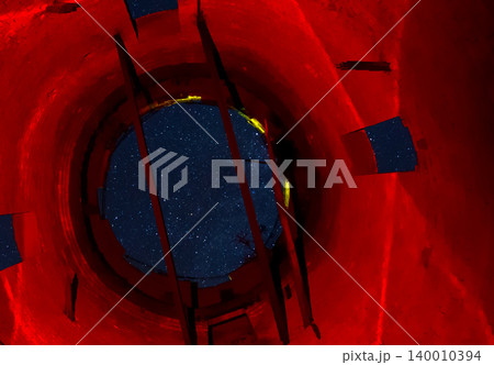 View of the starry sky through opening of the water tower. Stars in the sky. 140010394