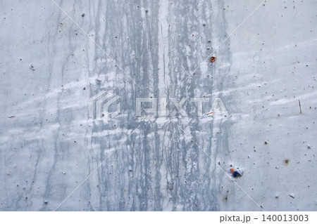 Gray Metal Surface with Dark Drip Streaks and Stain Marks, Weathered Industrial Abstract Texture Background Gray Metal Surface with Dark Drip Streaks and Stain Marks, Weathered Industrial Abstract Texture Background 140013003