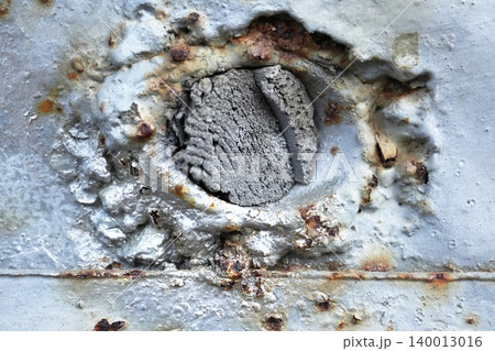 Macro of Heavily Corroded Metal Hole with Layered Rust and Solder, Industrial Decay Detail Macro of Heavily Corroded Metal Hole with Layered Rust and Solder, Industrial Decay Detail 140013016