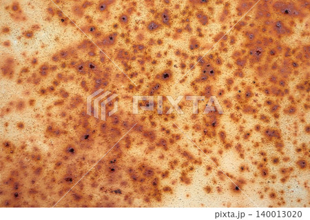 Dense Orange Rust Spreading Across Pale Metal Surface, Rich Mottled Corrosion Abstract Texture Background 140013020