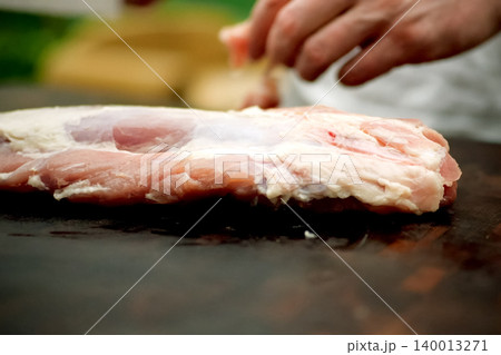 Cutting piece of pork meat on the table. Raw pork. Cutting piece of pork meat on the table. Raw pork. 140013271