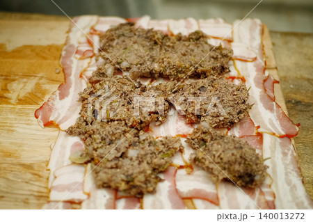 cooking meatloaf, minced meat with spices put in roll. cooking meatloaf, minced meat with spices put in roll. 140013272