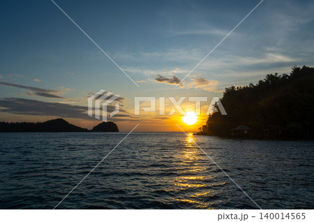 Sunset over Bolilanga Island, Togian archipelago, Sulawesi, Indonesia Sunset over Bolilanga Island, Togian archipelago, Sulawesi, Indonesia 140014565