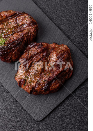 Beef mignon steak, rare, meat grilled with salt and spices. Beef steak Beef mignon steak, rare, meat grilled with salt and spices. Beef steak 140014990