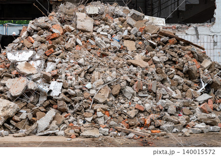Pile of Demolition Rubble and Concrete Debris at Urban Construction Site After Building Collapse Pile of Demolition Rubble and Concrete Debris at Urban Construction Site After Building Collapse 140015572