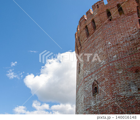 Low angle view of an ancient tower at Smolensk fortress under a cloudy sky. 140016148