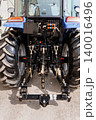 Rear View of Blue Agricultural Tractor with Heavy Duty Hydraulic Hitch and Large Rubber Tires 140016496