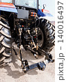 Rear View of Blue Agricultural Tractor with Large Rubber Tires and Three Point Hitch System 140016497