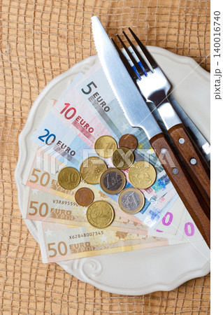 Euro money on kitchen table, coast of living Euro money on kitchen table, coast of living 140016740