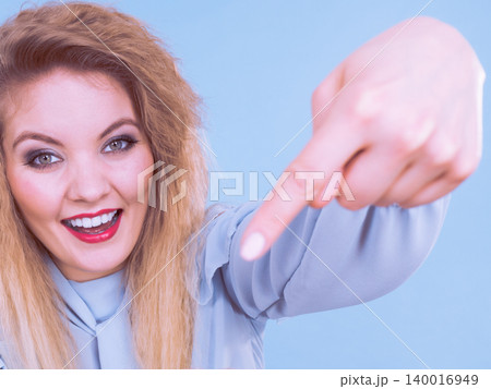 Woman pointing at herself Woman pointing at herself 140016949