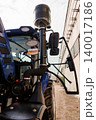 Close Up of Blue Agricultural Tractor Engine with Air Intake and Exhaust System Outdoors 140017186