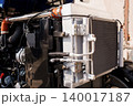 Close up of industrial radiator and engine components with metal pipes and silver cooling fins 140017187
