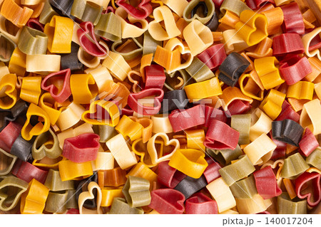 Colorful heart shaped pasta symbolizing love and cooking Colorful heart shaped pasta symbolizing love and cooking 140017204