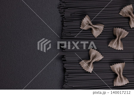 Black pasta spaghetti with brown farfalle bow tie pasta 140017212