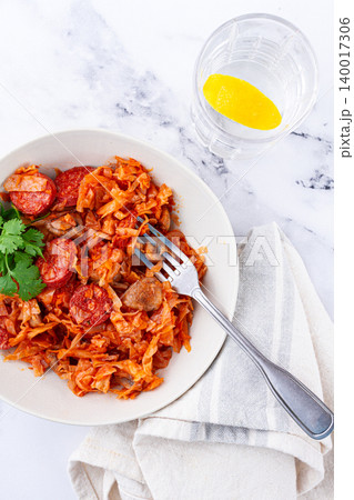 Bigos, Polish dish bigos, on a marble table, stewed meat with cabbage, chorizo sausages, mushrooms, homemade, without people, Bigos, Polish dish bigos, on a marble table, stewed meat with cabbage, chorizo sausages, mushrooms, homemade, without people, 140017306