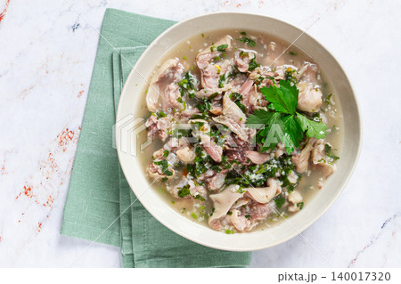 Muzhuzhi, a Georgian dish made from pork legs, with spices and herbs, homemade Muzhuzhi, a Georgian dish made from pork legs, with spices and herbs, homemade 140017320