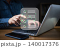 A person interacting with a digital checklist on a laptop, symbolizing task management, productivity, workflow organization, and efficient planning in modern digital work environments. 140017376