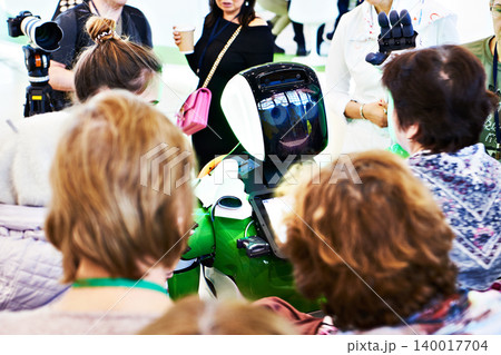 Robot information assistant among people at exhibition Robot information assistant among people at exhibition 140017704