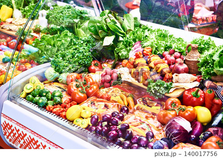 Vegetables and meat products on shop counter Vegetables and meat products on shop counter 140017756