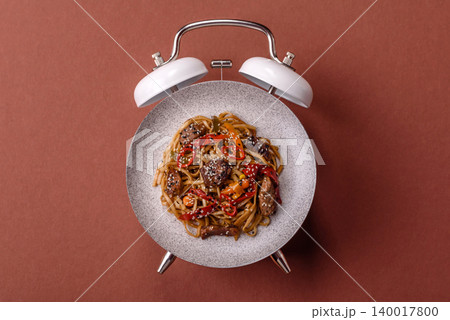 Food, Chinese or Japanese noodles with meat, vegetables, and spices. Noodles with beef or chicken Food, Chinese or Japanese noodles with meat, vegetables, and spices. Noodles with beef or chicken 140017800