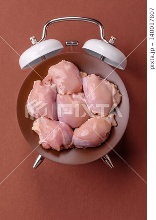 Raw chicken thigh fillet, boneless and skinless, for roasting. Raw thigh fillet Raw chicken thigh fillet, boneless and skinless, for roasting. Raw thigh fillet 140017807