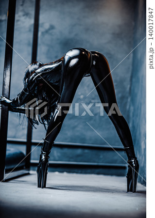 Bdsm style woman in black latex sexy posing 140017847