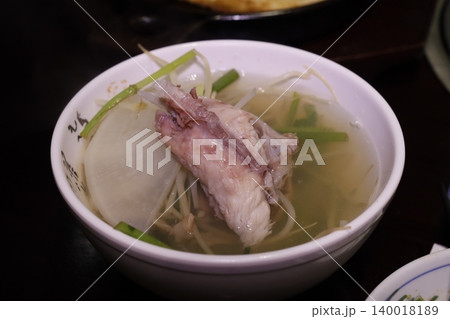Fish Soup with Radish and Green Onions in Bowl 140018189